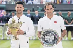  ?? AFP ?? Wimbledon champion Novak Djokovic, left, and runner-up Roger Federer.