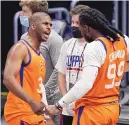  ?? MARK J. TERRILL/ASSOCIATED PRESS ?? Phoenix Suns guard Chris Paul, left, and forward Jae Crowder celebrate as time runs out in their Game 6 win on Wednesday in Los Angeles.
