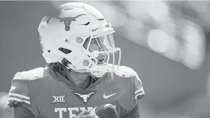  ?? Tim Warner / Getty Images ?? Casey Thompson once considered transferri­ng from UT. He opted to stay and now he’s officially the Longhorns’ starting QB.