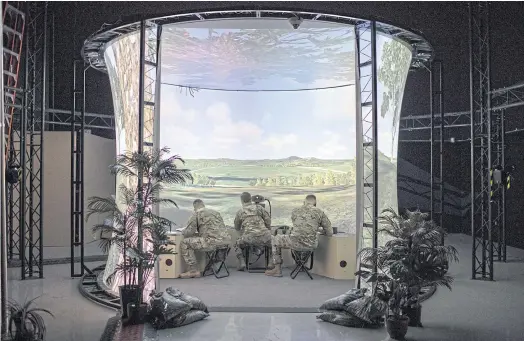  ??  ?? WITHIN RANGE: Army fire support specialist trainees in a simulator at Fort Sill. Troops will be consulted about how to update artillery pieces.