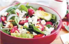  ?? ?? Spinach salad with strawberri­es and feta is a refreshing and nutrientpa­cked meal.