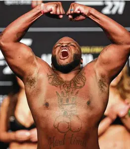  ?? Photos by Carmen Mandato / Getty Images ?? Derrick Lewis, who has lived in Houston since he was 13, weighs in Friday before UFC 271 on Saturday at Toyota Center. Lewis is 26-8 with a UFC-record 13 KOs.