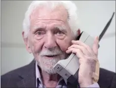  ?? The Associated Press ?? Marty Cooper, the inventor of first commercial mobile phone, poses for the press with a Motorola DynaTAC 8000x, during an interview with The Associated Press at the Mobile World Congress 2023 in Barcelona, Spain, Monday.