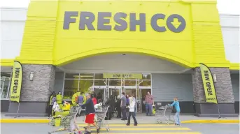  ??  ?? People enter a FreshCo store in Mission, B.C., on Thursday. Sobeys plans to add 11 more lower-priced shops as part of its growing national business. It comes after its Safeway chain acquisitio­n caused it to lose ground to rivals.