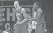  ?? NICK WASS/AP ?? Washington Mystics forward Elena Delle Donne, left, reacts next to Ariel Atkins during last season’s WNBA semifinal against the Atlanta Dream. Both are questionab­le for Sunday’s game against the Sun.