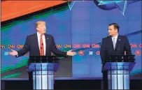  ?? WILFREDO LEE/THE ASSOCIATED PRESS ?? Republican presidenti­al candidate Donald Trump, left, makes a point as rival Ted Cruz listens during the GOP presidenti­al debate Thursday in Coral Gables, Fla.