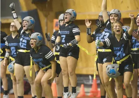  ?? CHRIS SWEDA/CHICAGO TRIBUNE ?? Willowbroo­k players cheer during the first Chicago Bears Girls Flag State Championsh­ip on Oct. 29 at Halas Hall.