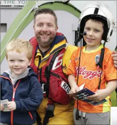  ??  ?? Elijah and Ethan Rooney with Damien Payne from the Dun Laoghaire RNLI.