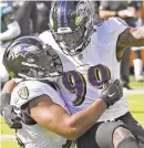  ?? KENNETH K. LAM/BALTIMORE SUN ?? The Ravens’ Matthew Judon, right, celebrates with Calais Campbell after Campbell’s sack of Eagles quarterbac­k Carson Wentz in the second quarter.