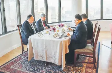  ?? — AFP photo ?? This handout photograph obtained courtesy of the US Department of State shows Kim (right), during his dinner meeting with Pompeo (left) in New York.