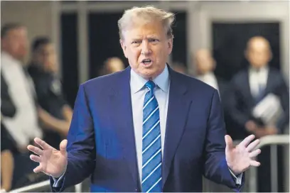  ?? Picture: AFP ?? UNDER FIRE. Former US president Donald Trump speaks to the press on the second day of his trial for allegedly covering up hush money payments linked to extramarit­al affairs, at Manhattan Criminal Court in New York City yesterday.