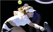  ?? AARON FAVILA, THE ASSOCIATED PRESS ?? Canada’s Eugenie Bouchard reaches for a return to China’s Peng Shuai in their match in the second round at the Australian Open on Wednesday.