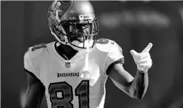  ?? JACOB KUPFERMAN/AP ?? Bucs receiver Antonio Brown warms up before Sunday’s game against the Carolina Panthers on Sunday.