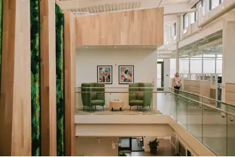  ?? Photos by Mason Trinca, © The New York Times Co. ?? The treasury building’s white interior and light- shaded oak help reduce the amount of electricit­y needed for lighting.