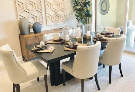  ??  ?? A staged dining room area sends the message of gracious entertaini­ng to potential buyers.