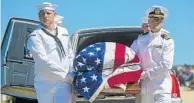  ?? CHRIS ZOELLER/ASSOCIATED PRESS ?? Navy sailors carry a casket with the remains of Seaman 1st Class Leon Arickx to be buried in Osage, Iowa, in July. The bodies of some sailors killed in Japan’s 1941 attack on Pearl Harbor are being laid to rest after being identified through DNA testing.