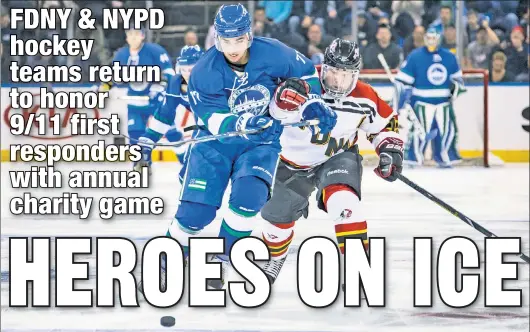  ?? Jared Silber/MSG Photos ?? BIG MATCH: Santino Ragone of NYPD (left) battles FDNY’s John Sullivan in the most recent “Hockey Heroes” game in March 2019. The teams will skate Thursday night at the Garden in the latest edition of their charity game after the 2020 edition was canceled by the pandemic.