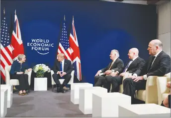  ?? AP PHOTO ?? President Donald Trump meets with British Prime Minister Theresa May at the World Economic Forum in Davos. From left, May, Trump, Secretary of State Rex Tillerson, National Security Adviser H.R. McMaster and White House chief economic adviser Gary Cohn.