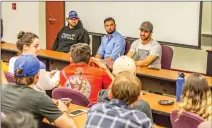  ?? Cory Rubin/The Signal ?? Campaign managers Zack Czajkowski, left, Ryan Valencia, as well as videograph­er Jeff Bomberger, talk with College of the Canyons students about what it means to work on a political campaign.