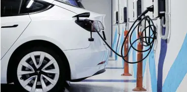  ?? Reuters ?? Good one: Electric vehicles use is a positive tipping point, according to climate scientists, along with exponentia­l growth of renewable energies, and expansion of plant-based diets. Their countereff­ects can help prevent ‘spiralling disaster’ ./