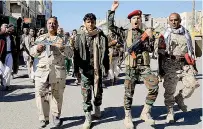  ?? AFP PHOTO ?? TERROR TAG
Houthi fighters brandish their weapons during a march in solidarity with Palestinia­ns in Gaza in Yemen’s Houthicont­rolled capital Sanaa on Jan. 11, 2024.