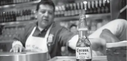  ?? GUSTAVO GRAFT / BLOOMBERG ?? Modelo’s Corona Extra beer is a Mexican best-seller, shown served in Mexico City, and is the biggest import beer in the U.S..