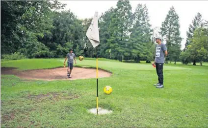  ?? Photo: Delwyn Verasamy ?? No jacket required: Players test their footgolf skills at Creek 9 in Roosevelt Park, Johannesbu­rg. The player follows the rules of golf but uses a football and must kick it into an (enlarged) hole.