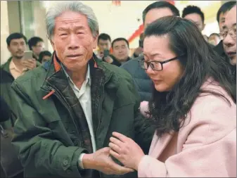  ?? JIN LIANGKUAI / XINHUA ?? Wang Qi is welcomed by a relative at Beijing Capital Internatio­nal Airport on Saturday. The former Chinese soldier, who was arrested during the Sino-IndianWar in the 1960s, was unable to leave India for 54 years.