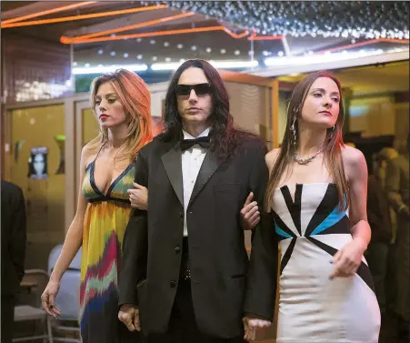  ??  ?? Mysterious auteur Tommy Wiseau (James Franco) is flanked by admirers in The Disaster Artist, a making-of story of one of the world’s strangest movies.
