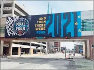 ?? David Borges / Hearst CT Media ?? A giant NCAA tournament bracket adorning the downtown JWU Marriott hotel is among the signs that the Big Dance is back in Indianapol­is.