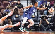  ?? Sean D. Elliot / Associated Press ?? Sun forward Alyssa Thomas (25) saves the ball from going out of bounds after stealing it from Sky center Stefanie Dolson, left, during their playoff game Thursday at Mohegan Sun Arena in Uncasville.