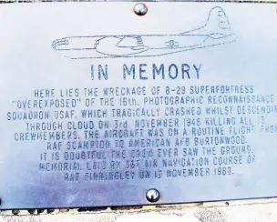  ??  ?? A plaque at the crash site commemorat­es those who lost their lives