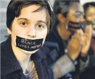  ?? Michael B. Thomas AFP / Getty Images ?? PROTESTORS take to St. Louis’ streets in March 2015, months after a killing in Ferguson, Mo.