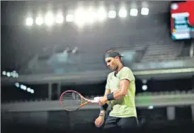  ?? REUTERS ?? Amid an unusual silence on an empty court, defending champion Rafael Nadal celebrated his 35th birthday with a 6-0, 7-5, 6-2 win against Richard Gasquet under the lights on Thursday night.