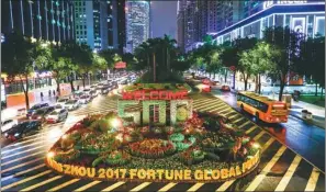  ??  ?? A flower bed on Jinsui Road in Guangzhou welcomes guests to the 2017 Fortune Global Forum.