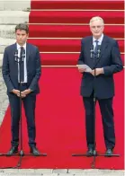  ?? — AFP ?? France newly appointed Prime minister Michel Barnier (R) delivers a speech next to France outgoing prime minister Gabriel
// ' ȅ Ȇ 0-$)" /# # ) *1 - - (*)4 / the Hotel Matignon in Paris.