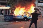  ?? ASHLEE REZIN GARCIA/CHICAGO SUN-TIMES VIA AP ?? A Chicago police vehicle burns during a May 30 protest over the killing of George Floyd.