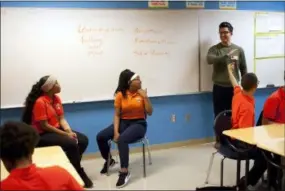  ?? BENNY SNYDER — THE ASSOCIATED PRESS ?? Marshall Motsenbock­er, standing right, a researcher at the University of Texas Southweste­rn Medical Center, leads a Youth Aware of Mental Health session at Uplift Hampton Preparator­y School in Dallas.