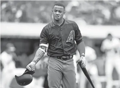  ?? D. ROSS CAMERON/AP PHOTO ?? Diamondbac­ks Ketel Marte tosses his helmet after striking out to end the top half of the fourth inning of Saturday’s game against the Athletics in Oakland.