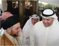  ??  ?? Kuwait Times Editor-in-Chief Abd Al-Rahman Al-Alyan (right) greets Ammar Al-Hakeem.
