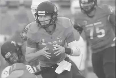  ?? OttO Kitsinger / AP ?? Boise State’s Thomas Stuart runs the ball during a spring football scrimmage. Sports books give the team 7-5 odds to win the league.