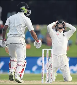  ?? Getty Images. Picture: ?? Joe Root reacts as New Zealand’s Ish Sodhi survives a Mark Wood delivery.