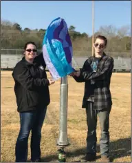  ??  ?? Balloon: Smackover High School students Laken Loomis and Zach Lawrence ready their air balloon for launch on the football field.