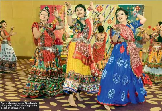  ??  ?? Garba choreograp­her Bina Mehta, along with others, dancing to the beats of garba songs