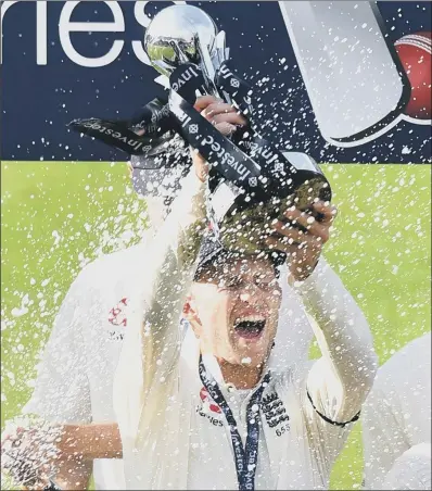  ?? PICTURE: ANTHONY DEVLIN/PA WIRE ?? CHAMPAGNE MOMENT: Yorkshire’s Joe Root is sprayed with bubbly as he holds aloft the Investec Series trophy after England – in their first series under his captaincy – beat South Africa at Old Trafford to complete a 3-1 triumph in the four-match...