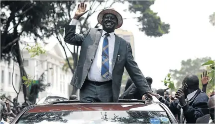  ?? / SIMON MAINA/ AFP ?? Raila Odinga waves at supporters as he leaves the Supreme Court in Nairobi last Friday, after the court ordered a new presidenti­al election after annulling the results of last month's poll.