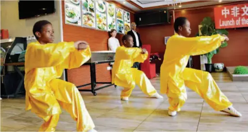  ??  ?? May 20, 2018: Local children perform martial arts at the inaugural ceremony of the Preparator­y Committee of Africa-china Culture and Arts Exchange Society in Gaborone, Botswana. VCG