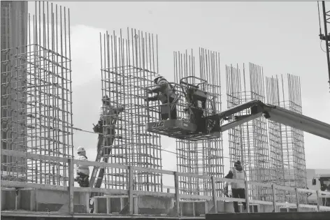  ?? ASSOCIATED PRESS ?? IN THIS APRIL 16, 2020, FILE PHOTO work continues on a bridge on the Interstate Highway 75 project in Troy, Mich.