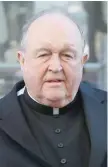  ?? — AFP ?? Archbishop Philip Wilson arrives at Newcastle Local Court on Tuesday.