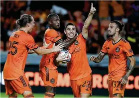  ?? Eric Christian Smith / Contributo­r ?? Dynamo midfielder Matias Vera (22) celebrates his equalizing goal in the 72nd minute with Griffin Dorsey, from left, Fafa Picault and Maxi Urruti.